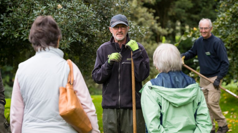Garden volunteers speaking to visitors at Uppark House and Garden